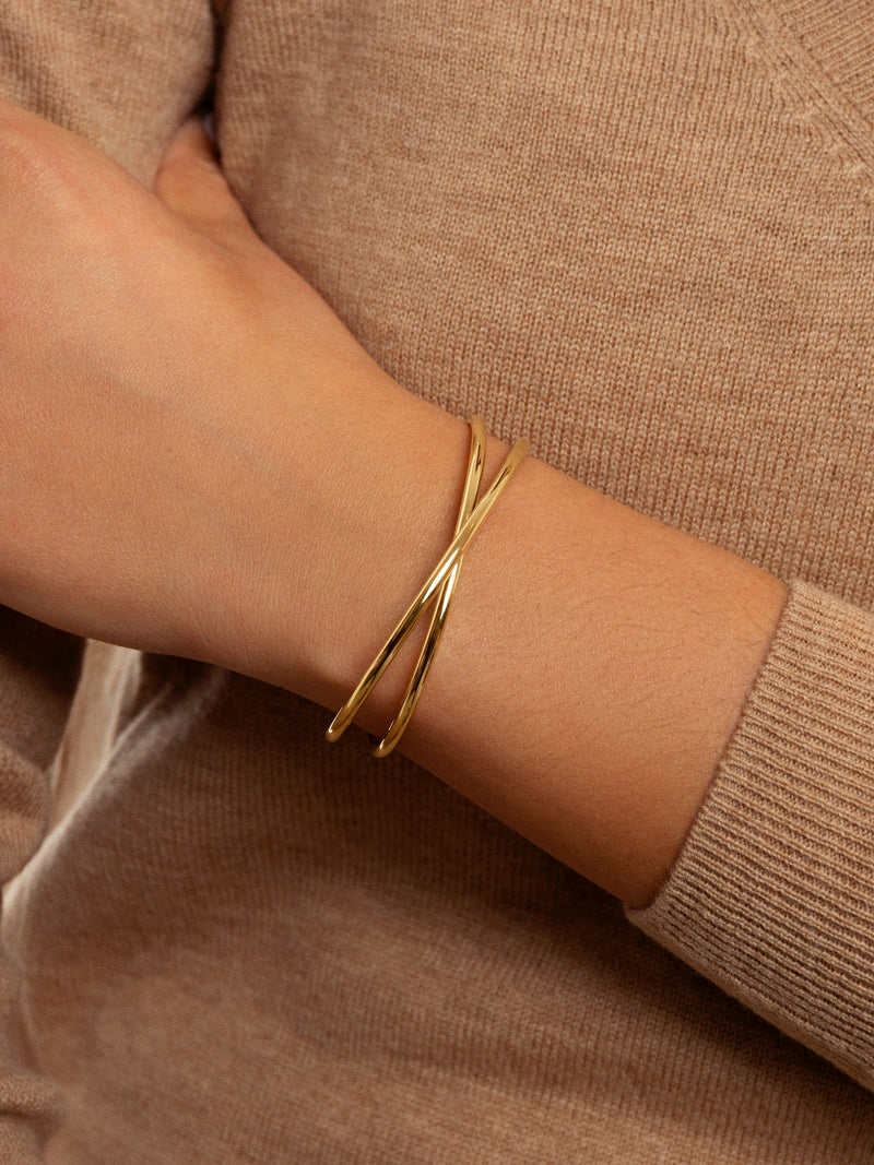 Bracelete Cruzado Aço Banho de Ouro